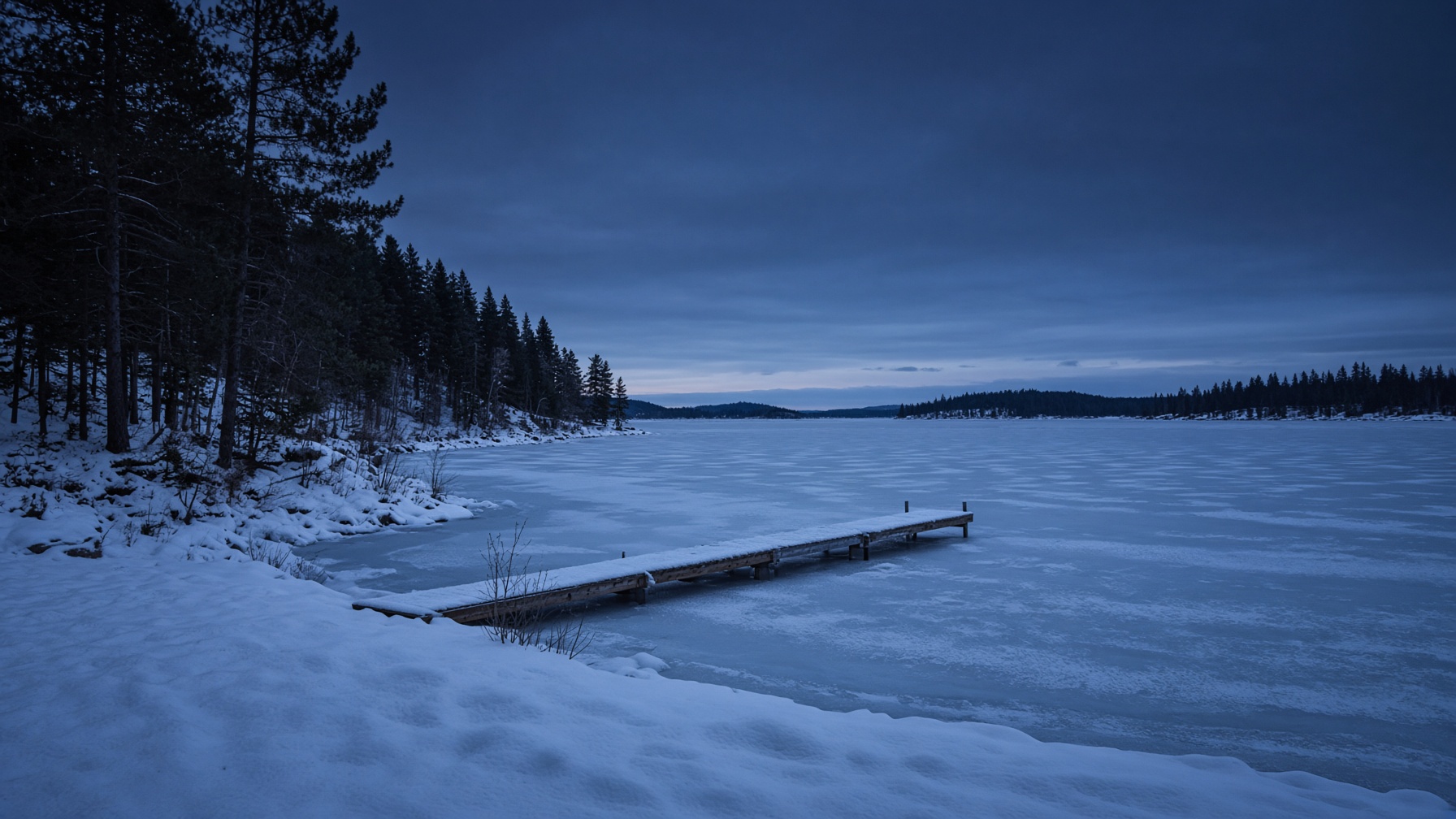 Winter lake and pine forest at dusk